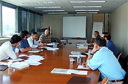 Colour photograph showing the Paris CIB W14 meeting in progress on 10th & 11th September 2002.  Taken by C J Walsh.